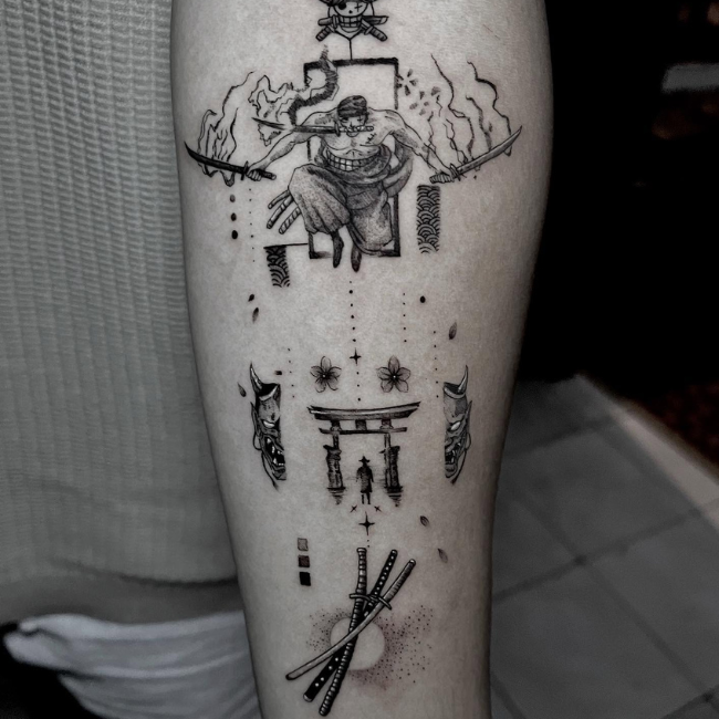 Abstract black ink tattoo with symbols on leg.